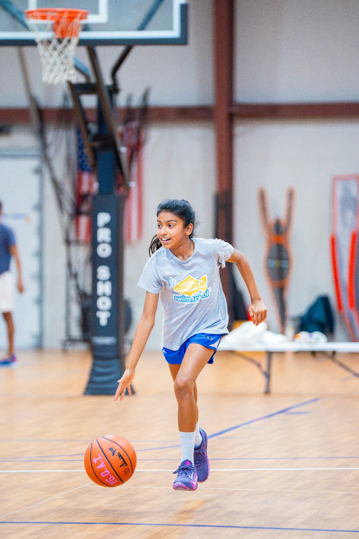 Athlete pushing the ball up the court in transition during a Saturday session