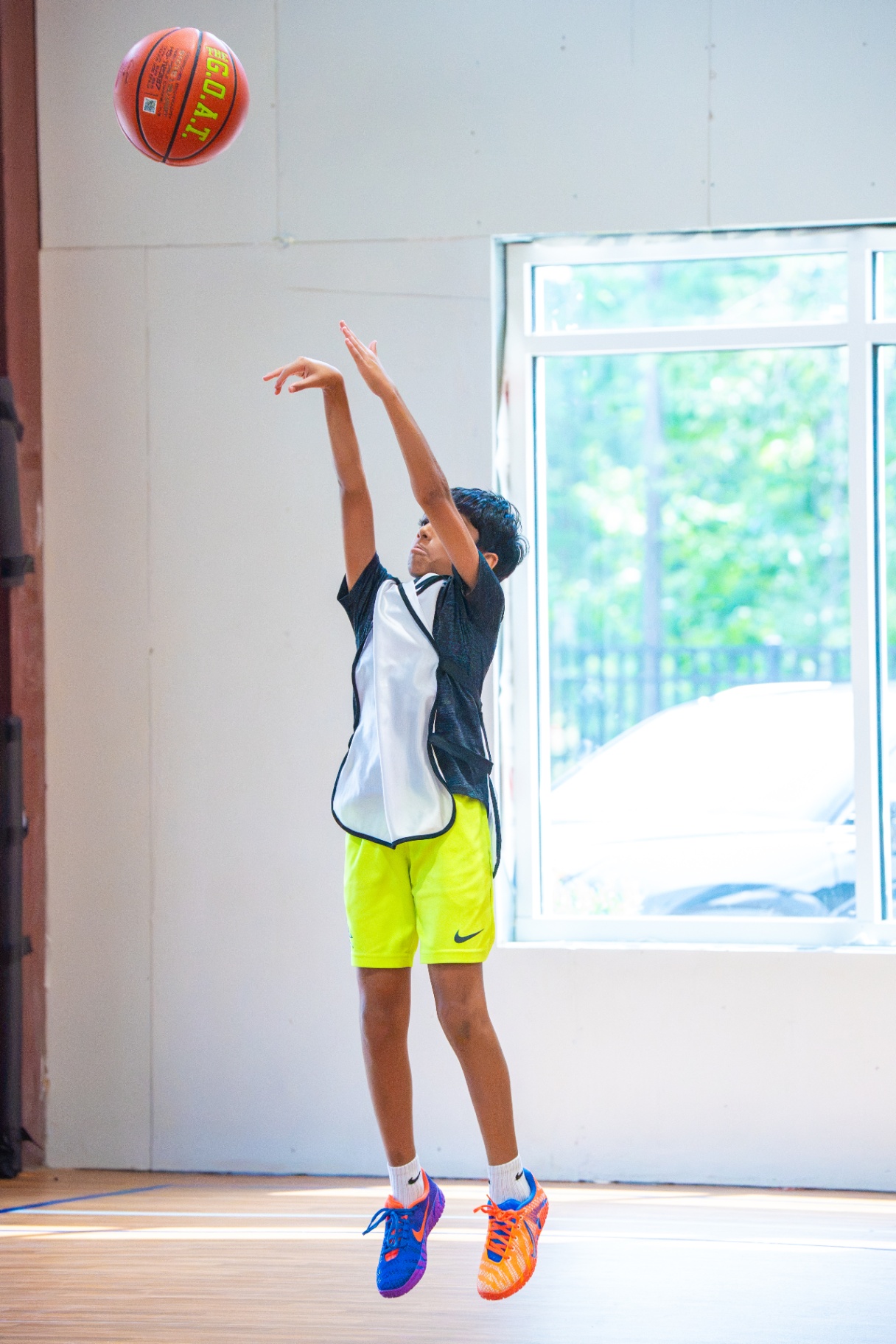 Athlete holding a picture-perfect shooting follow-through mid-air