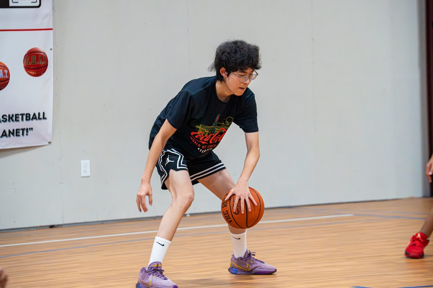 An athlete controlling a low dribble during a skills session